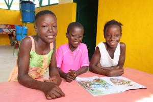 three children at child-friendly space