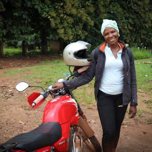 female agent with her motorbike