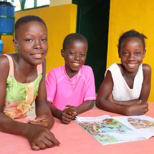 three children at child-friendly space