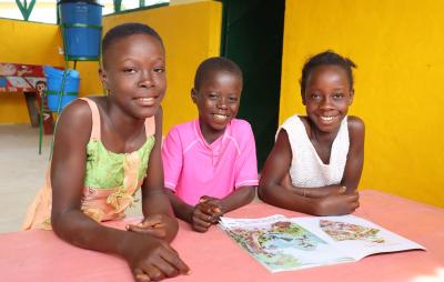 three children at child-friendly space